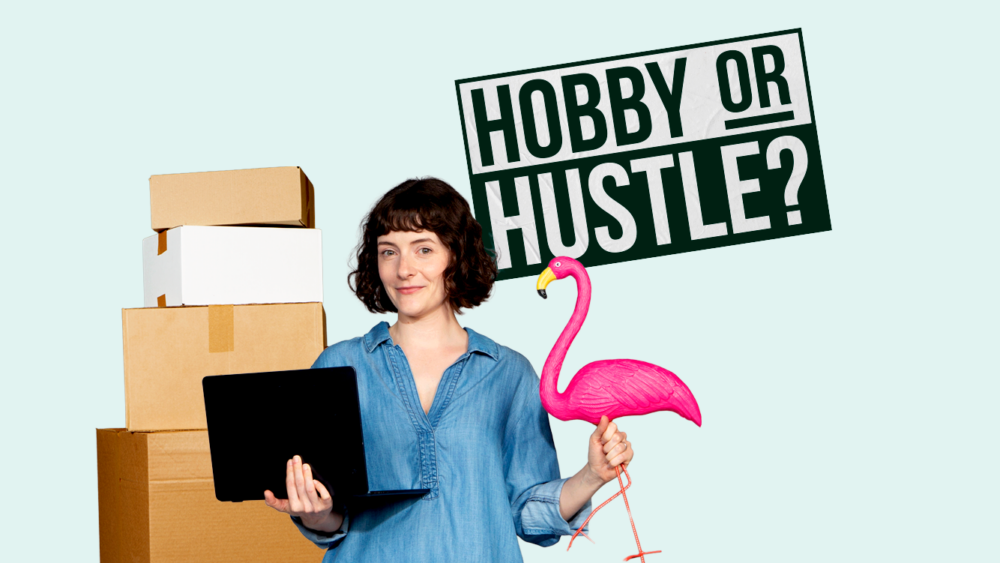 A woman holding a flamingo and a laptop next to a stack of card board boxes.